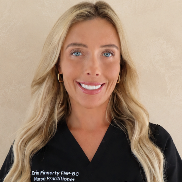 Woman with blonde hair wearing a black shirt with text against a beige background