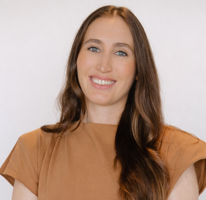 Woman wearing a brown sleeveless top against a white background